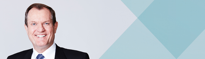 Photo of Chris Jordan with blue background 