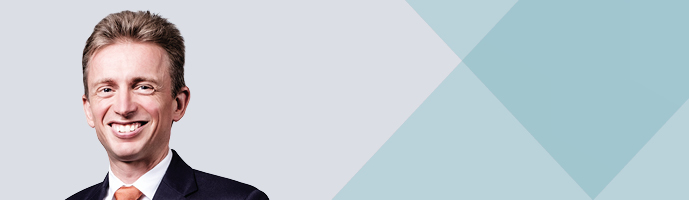 Photo of Jeremy Hirschhorn with blue background