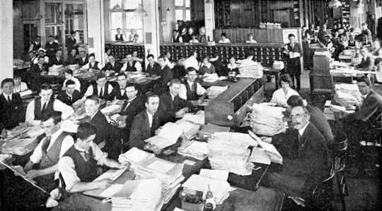 The overcrowded working conditions of the records section in Melbourne, c.1919.