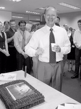 Commissioner Carmody cuts a cake to celebrate the launch of the Business Portal in December 2004.