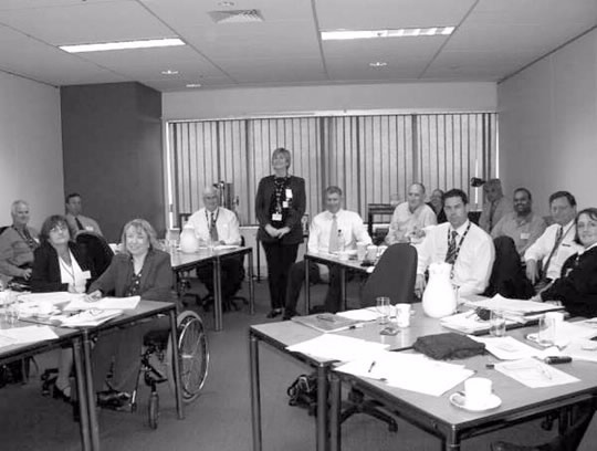 A site leadership meeting in Melbourne in 2005.Left to right: Rob Deuchar, Wendy Cavanagh, Timothy Dyce, Kaye King, Adrian Morgan, Anne Ellison, Chris Wood, Paul Gibb, Leanne Ansell-McBride, Matthew Mitchell, David Diment, Adhir Singh, Andrew Millet, Veronica Williams.