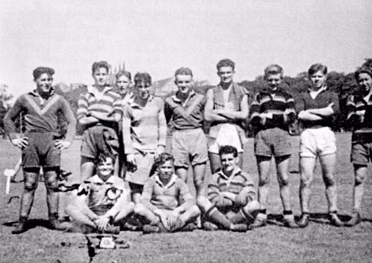 Sydney branch rugby league team, 1941. Back row, left to right: Pat O'Connor, Jack Morahan, Lance Ferguson, Alby Kemister, Jack Foran, Alf Green, Alan Fox, Jim Fullerton, George Pearton. Front: Bobby Pearson, Nev Hall, Paul Crilley. With so many tax officers enlisting for military service the team comprised junior clerks straight from school. They played before record crowds on the Sydney Domain.