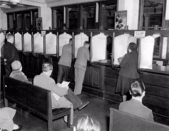 The enquiries counter on the first floor of the Savings Bank Building, Sydney, 1954.