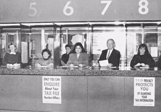 Commissioner Boucher takes his turn at the enquiries counter as part of the Year of Service.